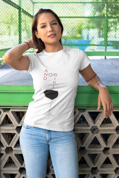 A stylish woman showcasing a Funny Wine Lover Women's T-Shirt featuring the slogan 'And Now Wine' with a minimalist wine glass graphic. Perfect for wine enthusiasts, this luxurious graphic tee combines humour and elegance.
