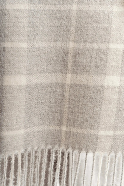 Versatile Luxury Undyed Alpaca Plaid Scarf styled with coordinated alpaca accessories, offering a timeless look for cozy winter outings.