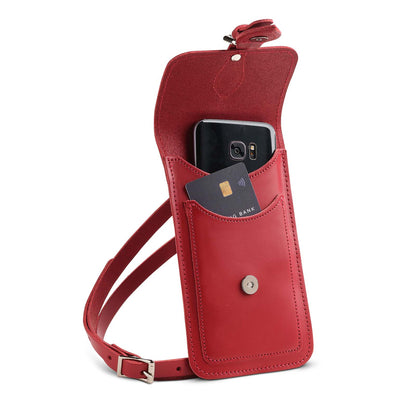 Versatile red leather mobile phone pouch by Zatchels, displayed with its adjustable strap, perfect for both casual and formal occasions.