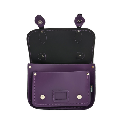 Spacious interior of the handmade purple leather satchel, designed to fit essentials like smartphones, wallets, and cosmetics perfectly.