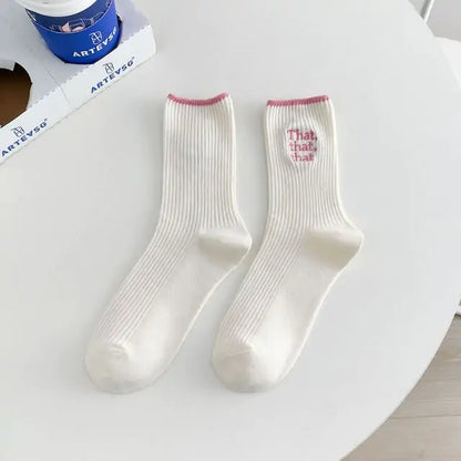 Elegant White Embroidered Socks for Women with Unique Japanese-Style Font Design featuring playful pink cuffs, a luxurious accessory for any wardrobe.