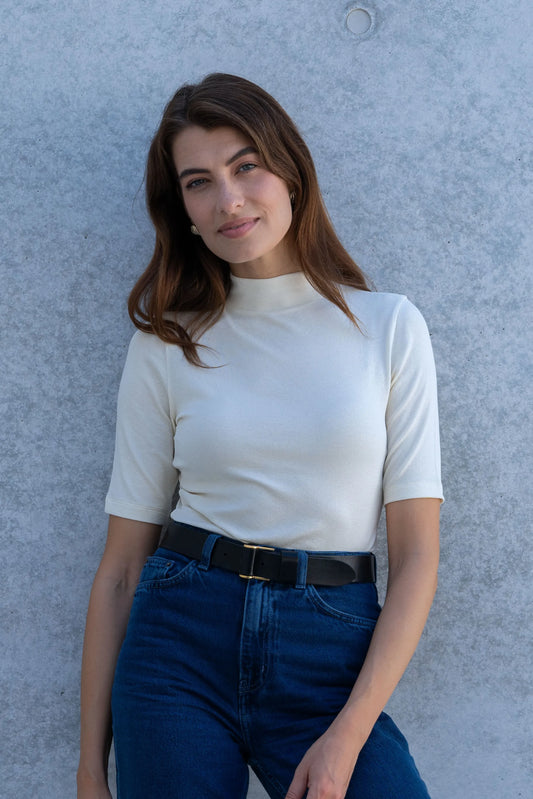 Luxurious Women's Mock Neck Micro Modal Top in Ribbed Half Sleeve, showcasing its soft fabric and elegant silhouette, ideal for sophisticated layering and versatile styling.