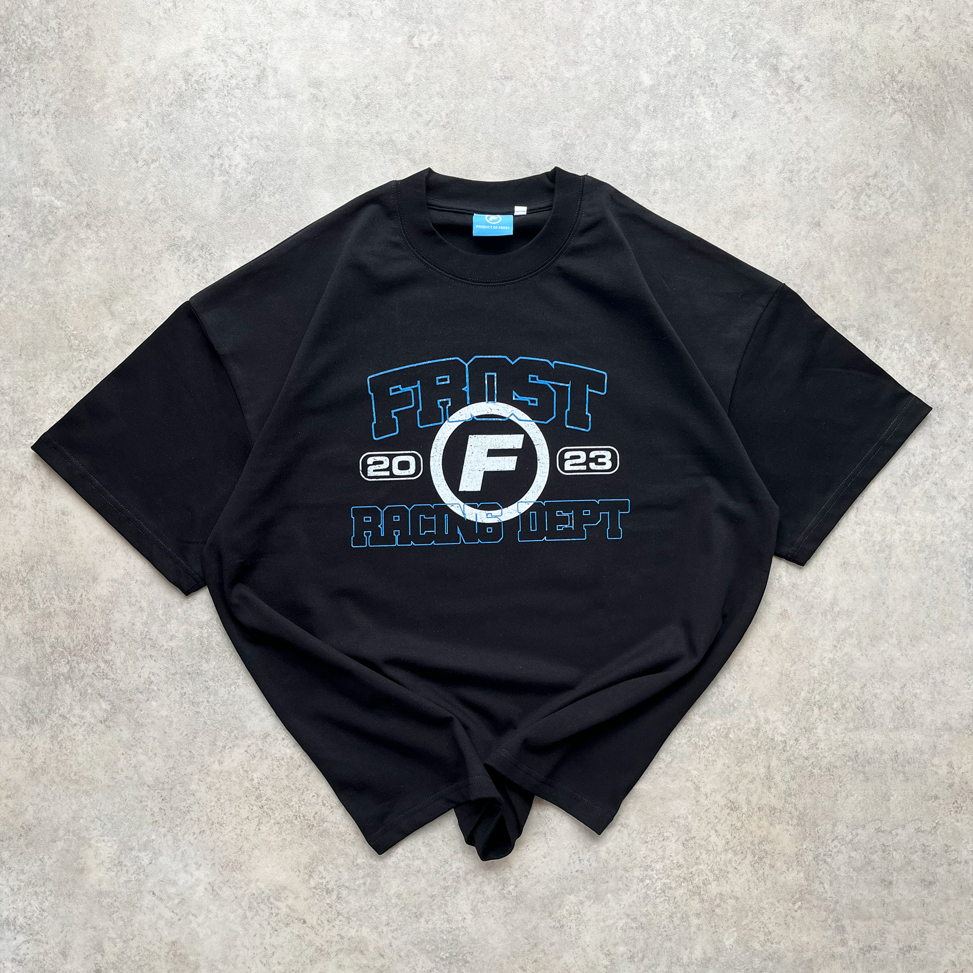 Back view of FROST Racing Department black t-shirt, emphasizing the distinctive DTG print inspired by vintage racing crew aesthetics.