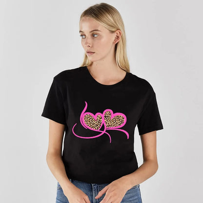 Stylish model wearing Leopard Lips Print Women's T-Shirt by Dazzling Dreams Studio, presenting a chic summer look paired with casual shorts.