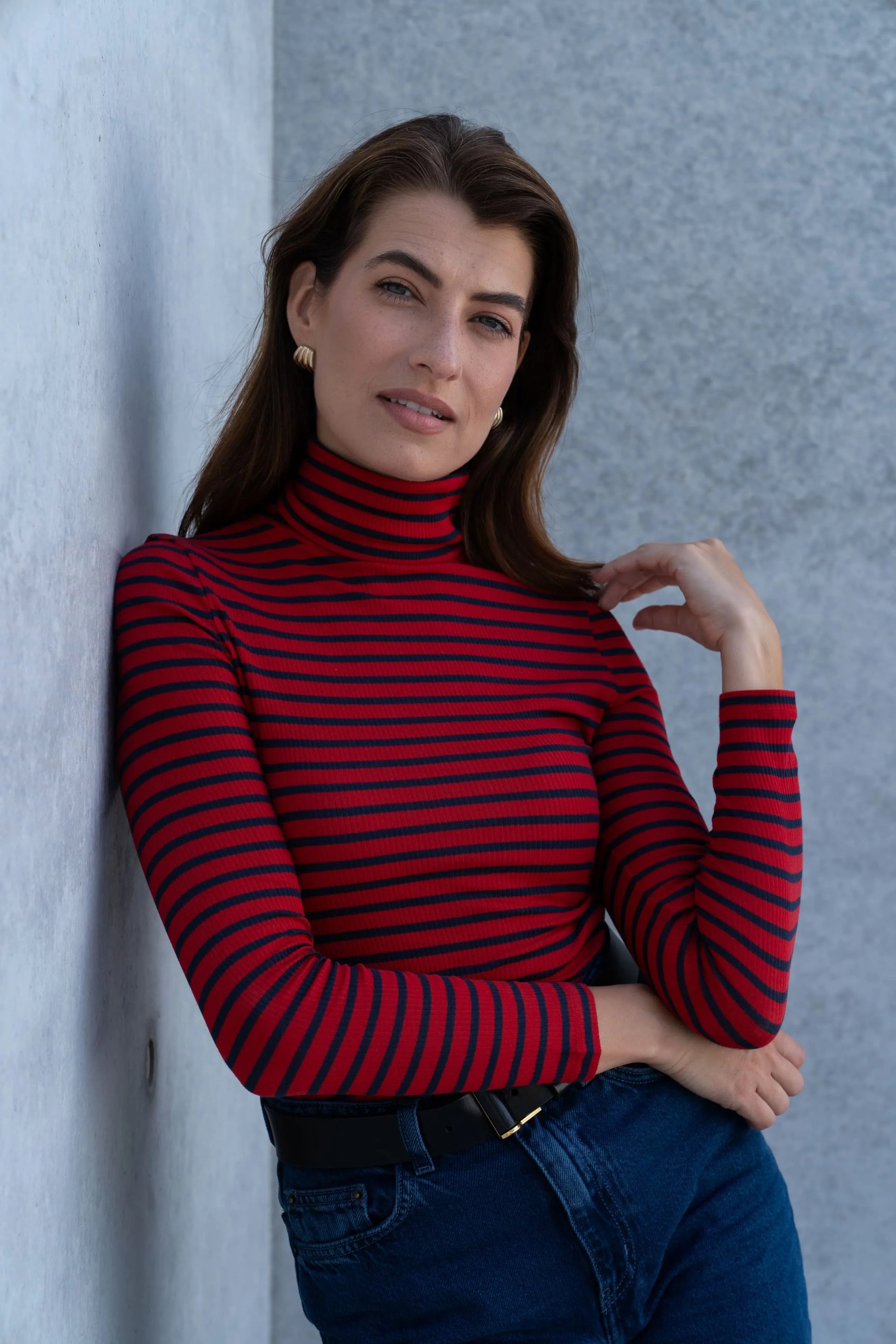 Close-up view of the sophisticated striped fabric of the luxury women's cotton roll neck top, showcasing quality craftsmanship.