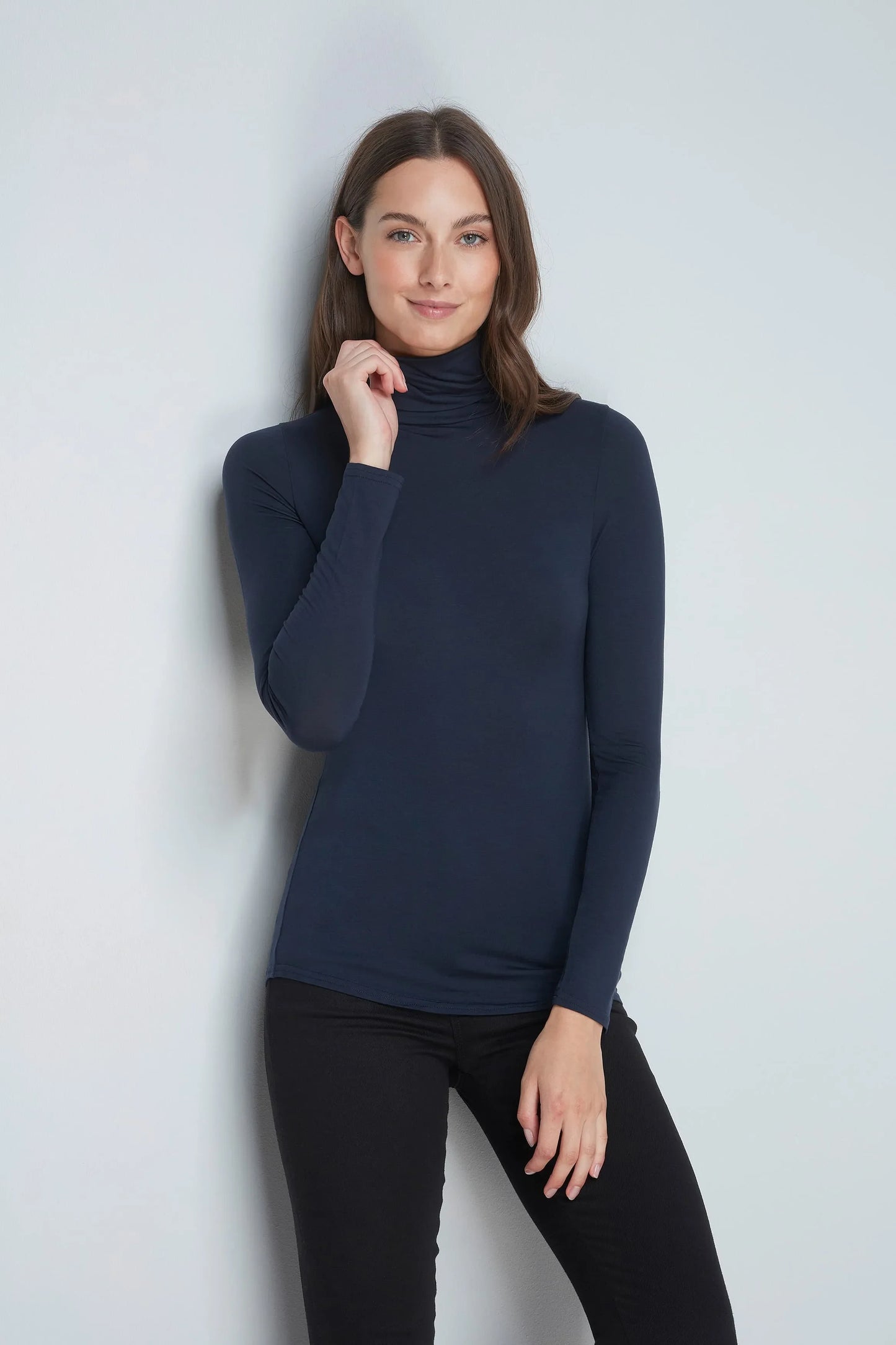 Close-up view of Women's TENCEL™ Micro Modal Roll Neck Top fabric, highlighting its breathable texture and sustainable softness for ultimate comfort.