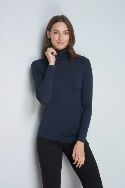 Close-up view of Women's TENCEL™ Micro Modal Roll Neck Top fabric, highlighting its breathable texture and sustainable softness for ultimate comfort.