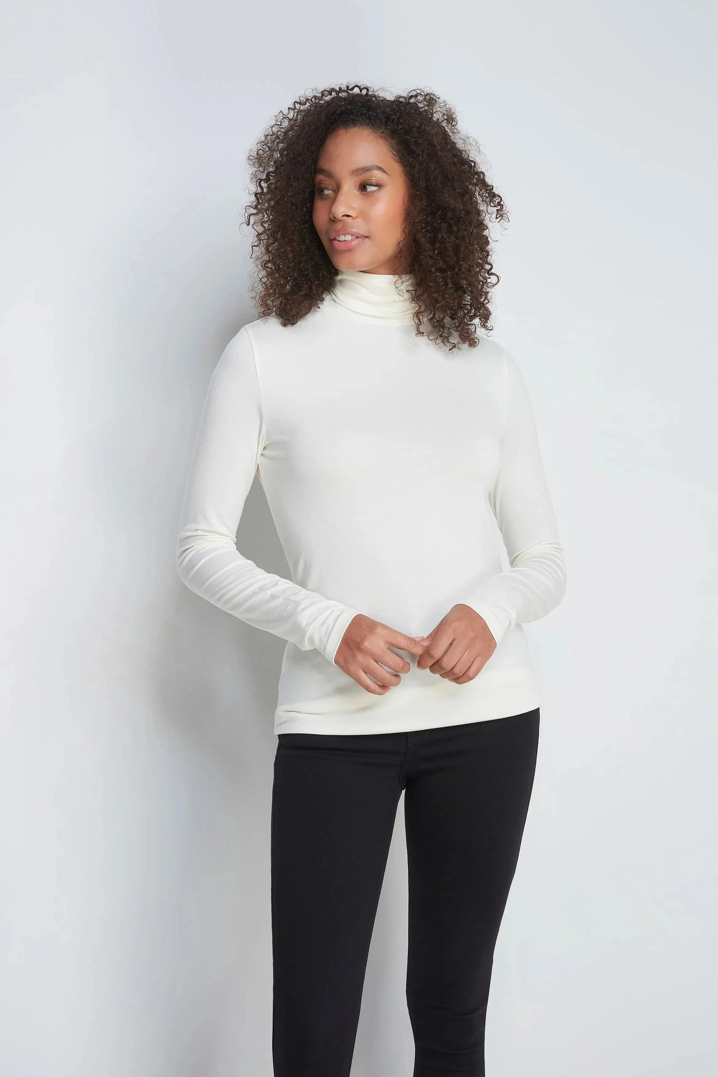 Versatile Women's Luxury Roll Neck Top made from sustainably sourced TENCEL™ Modal, perfect for both casual and office wear.