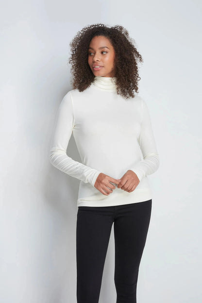 Versatile Women's Luxury Roll Neck Top made from sustainably sourced TENCEL™ Modal, perfect for both casual and office wear.