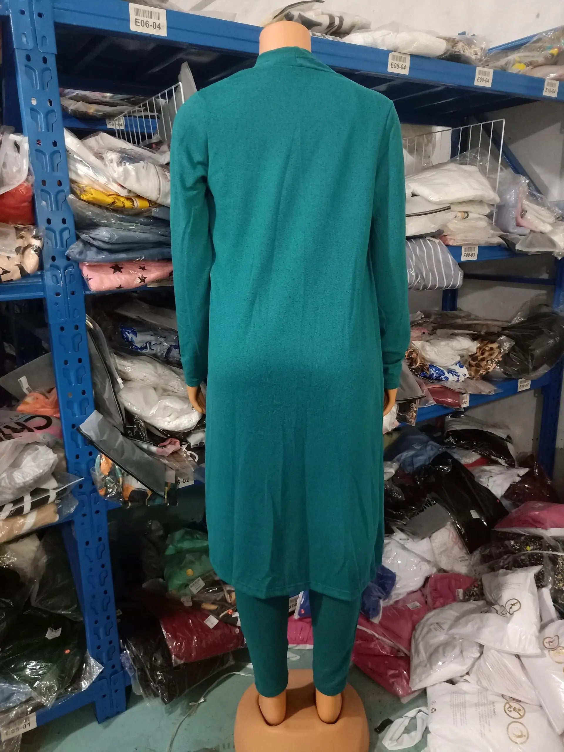 Stylish ankle-length pants from a two-piece jumpsuit set, designed with a pencil cut and drawstring closure, offering a perfect blend of comfort and elegance.