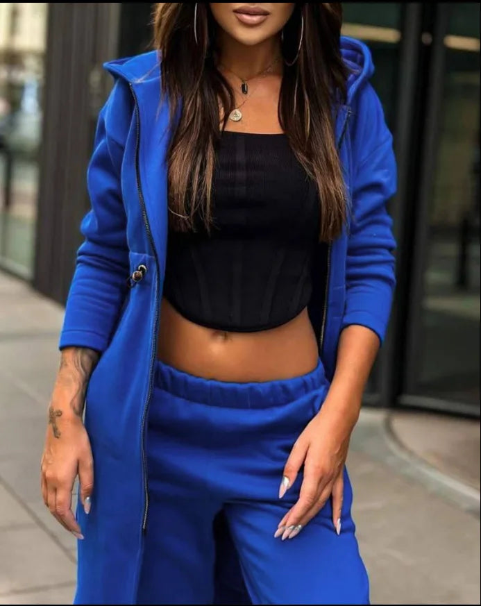 Close-up of fabric details on a premium women's long coat tracksuit, highlighting the soft cotton linen blend and luxury quality.