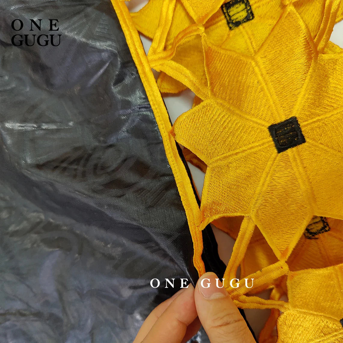 Model wearing a stunning gold and white African Bazin dress robe, epitomising elegance with flowing fabric and intricate designs, ideal for weddings and formal events.