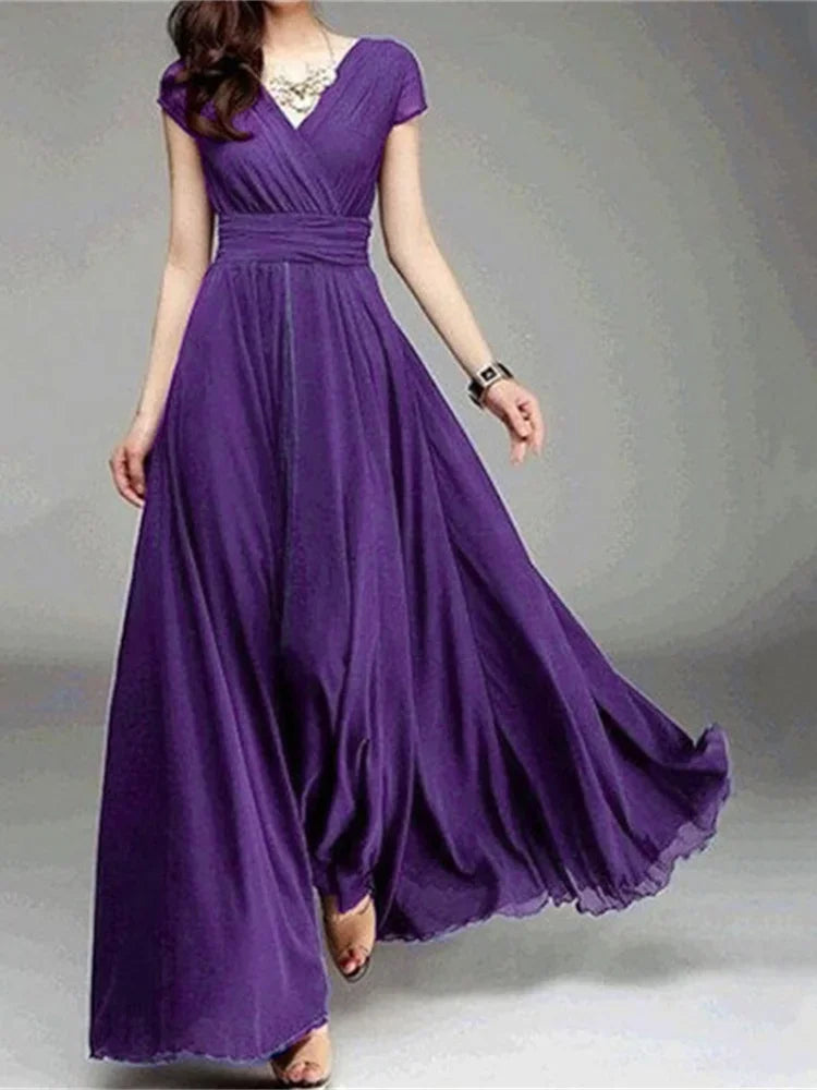 Stylish model showcasing a slim fit, ankle-length bodycon dress with a regal silhouette, ideal for sophisticated daytime or evening events.