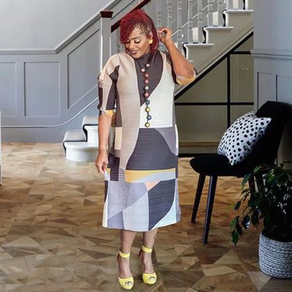 Beautifully crafted long Dashiki dress for women, featuring elegant 3/4 sleeves and made from soft polyester fabric.