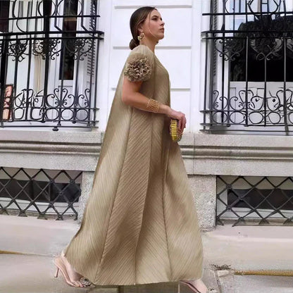 Luxurious ankle-length women's maxi dress showcasing exquisite pleated design and delicate petal sleeves, perfect for stylish events.