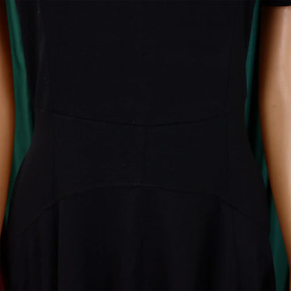 Close-up view of high-quality polyester and spandex fabric of a luxury women's pleated dress, showcasing exquisite workmanship.