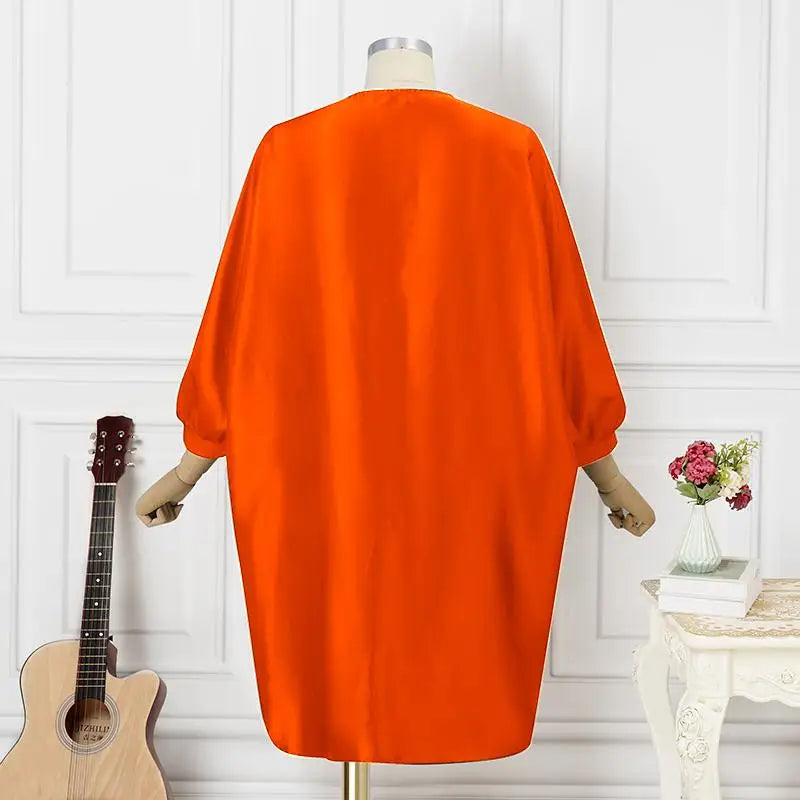 Exquisite look of the Plus Size 5XL VONDA Women’s Bohemian Floral Midi Dress with vibrant orange hues, ideal for beach outings and casual festivities.