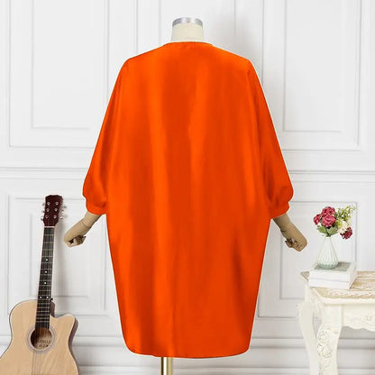 Exquisite look of the Plus Size 5XL VONDA Women’s Bohemian Floral Midi Dress with vibrant orange hues, ideal for beach outings and casual festivities.