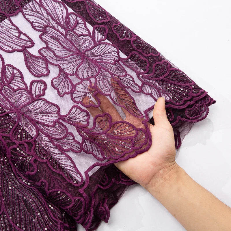 Luxurious African Milk Silk Mesh Lace Fabric with Sequins, ideal for stunning Nigerian wedding dresses, featuring intricate embroidered tulle details.