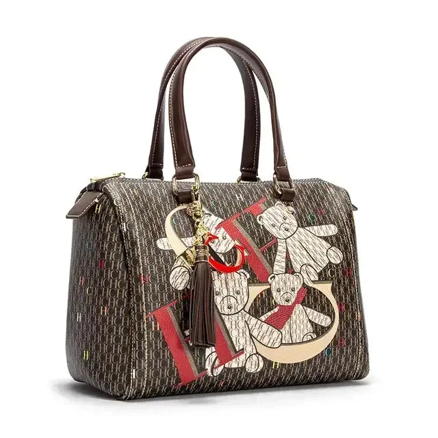 Elegant women's commuter crossbody bag with a colourful printed monogram design, perfect for stylish transportation.
