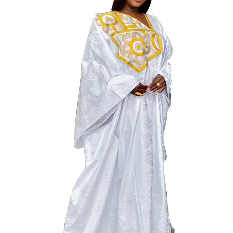 Fashionable African long dress in a chic plus size design, complemented by a stylish scarf, ideal for showcasing elegance and style in women's traditional clothing.