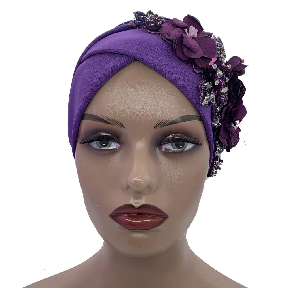 Elegant African head wrap in luxurious fabric with strategically placed rhinestones, designed for upscale fashion and versatility throughout all seasons.
