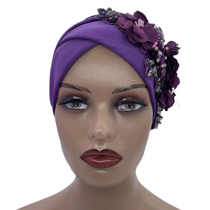 Elegant African head wrap in luxurious fabric with strategically placed rhinestones, designed for upscale fashion and versatility throughout all seasons.