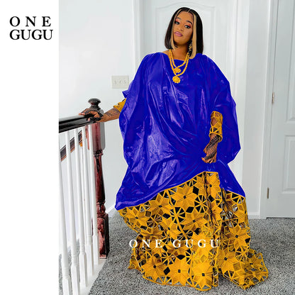 Full-length display of a chic African Bazin dress robe, perfect for special occasions like weddings and parties, exuding elegance and grace.