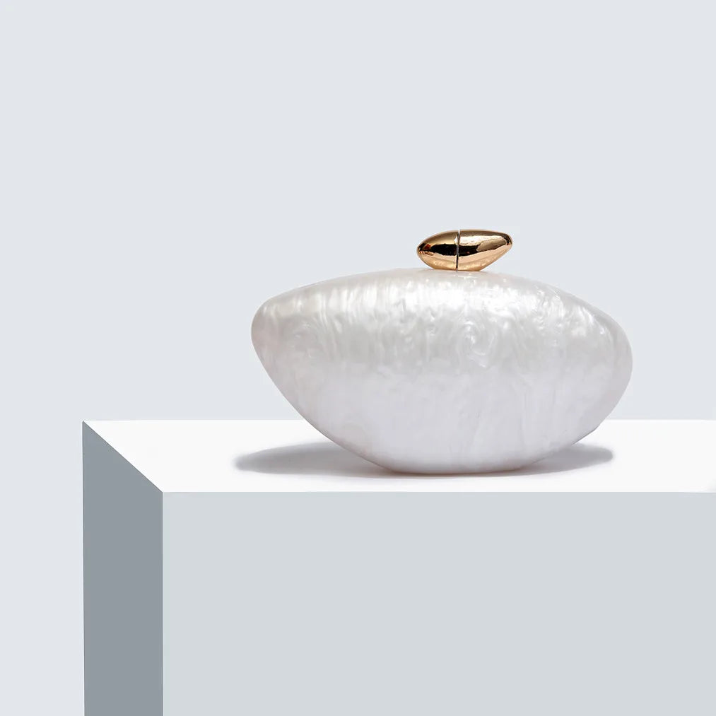 Sophisticated minaudiere evening bag in chic design, suitable for formal occasions and celebrations.