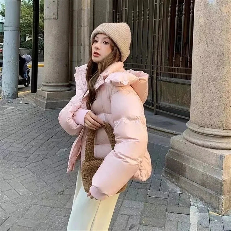 Chic women’s winter coat featuring a contemporary hood and full sleeves, ideal for a fashionable yet functional casual look.