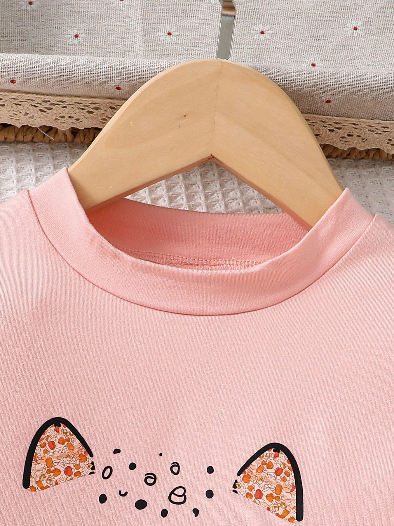 Elegant girls' slim denim pants designed to complement a pink cartoon top, crafted for comfort and style, perfect for young fashionistas aged 4-6 years.