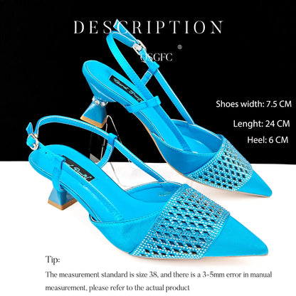 Matching black gold handbag featuring a stylish buckle strap and long chain shoulder strap, perfect for elegant occasions.