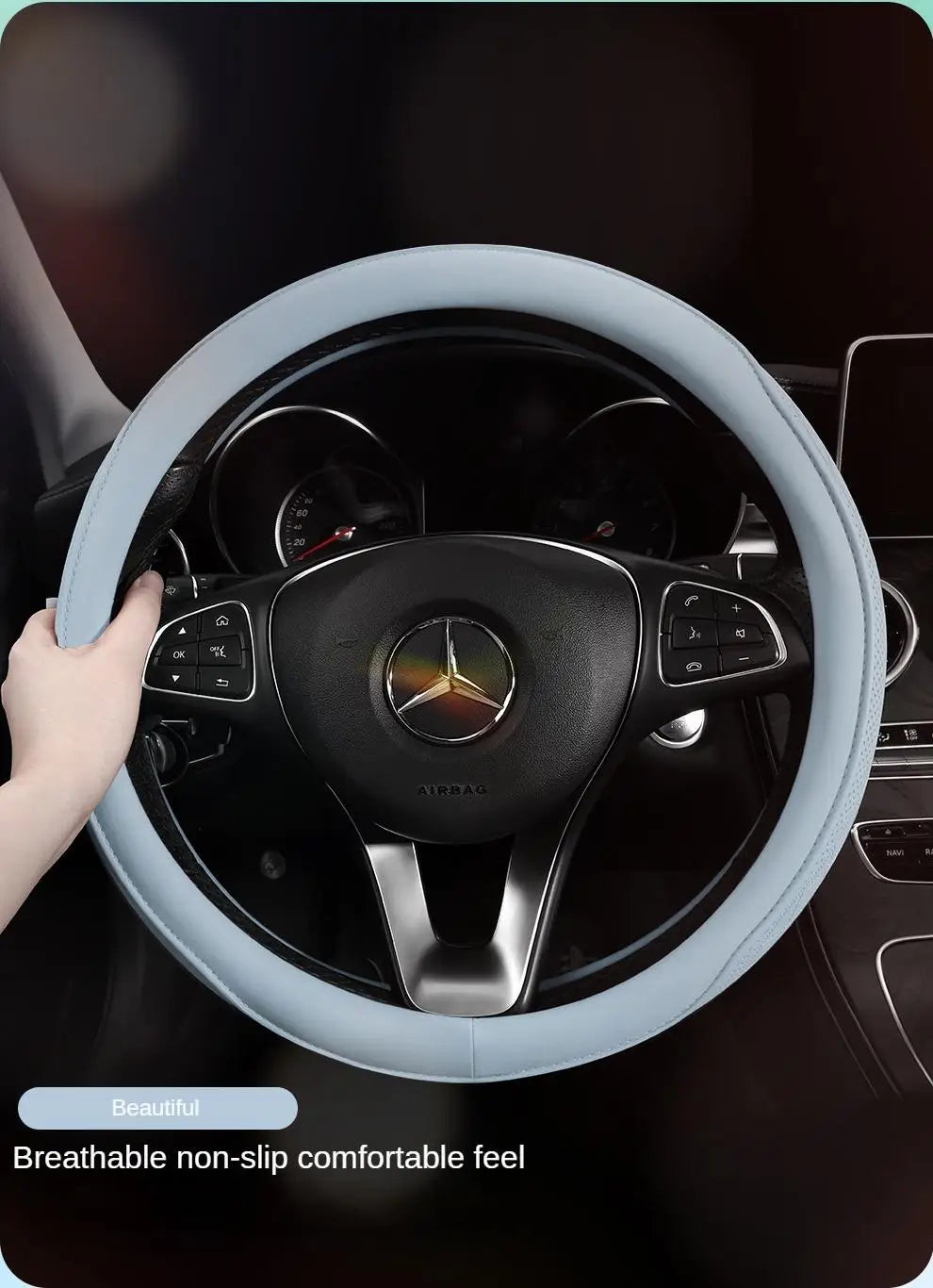 Close-up of the exquisite Napa leather perforated patchwork steering wheel cover, highlighting its craftsmanship and luxurious finish.