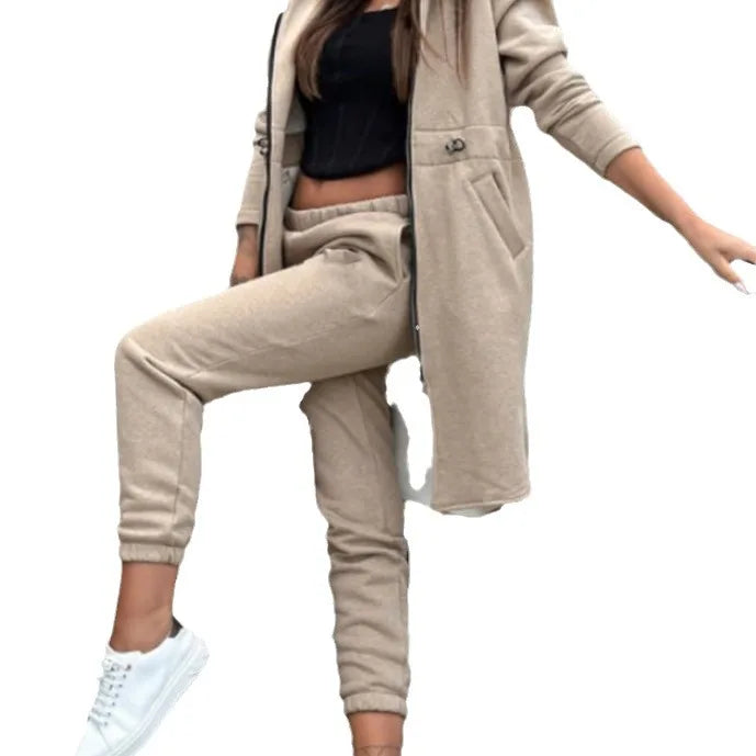 Stylish and sophisticated luxurious women's tracksuit, showcasing straight cut and mid-waist design ideal for elegant autumn attire.