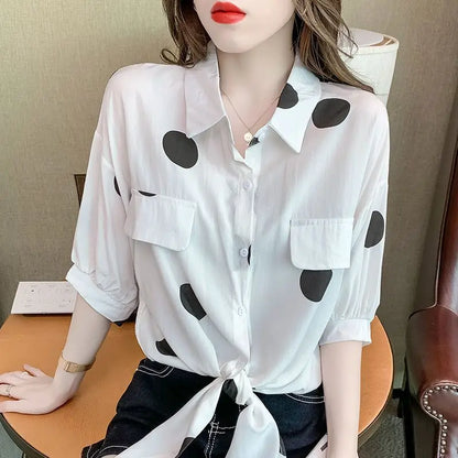 Elegant women's oversized polka dot blouse featuring a stylish bandage bow detail, perfect for summer office wear.