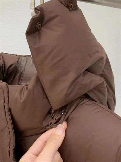 Luxurious women's down coat in solid colour, designed for comfort and style in autumn and winter streetwear.