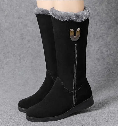 Sumptuous winter boots for women with round toe, flat heel, and sophisticated faux suede material, perfect for warm yet stylish wear.