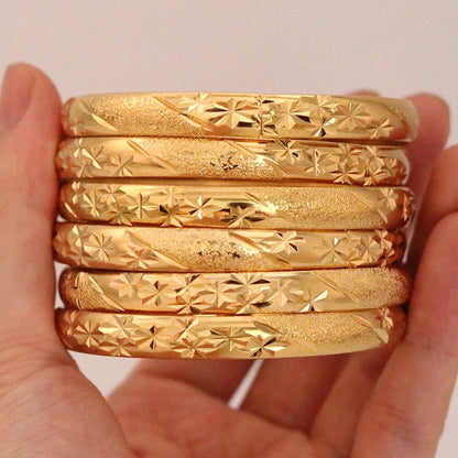 Luxurious 8mm Dubai Gold Bangles set of 6, crafted for women and men. Elegant Ethiopian bracelets featuring intricate flower patterns ideal for Saudi Arabic weddings and gifting to brides.