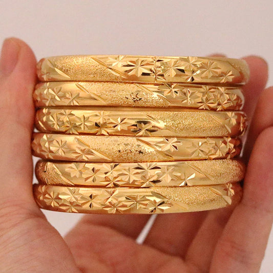 Luxurious 8mm Dubai Gold Bangles set of 6, crafted for women and men. Elegant Ethiopian bracelets featuring intricate flower patterns ideal for Saudi Arabic weddings and gifting to brides.