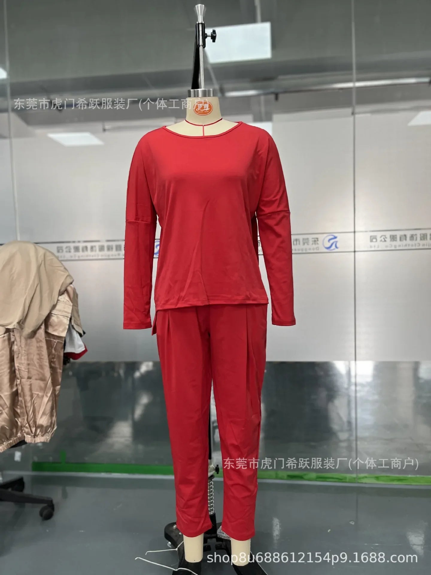 Elegant women's two-piece set featuring a solid full sleeve O-neck top and ankle-length midi waist long pants with pockets, perfect for autumn/winter luxury styling.