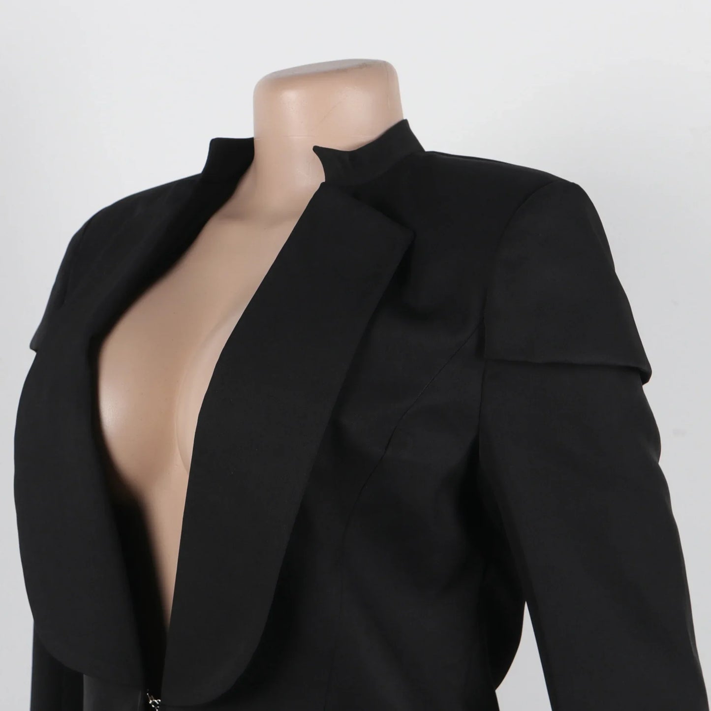 Women's X-Long Blazer Coat elegantly styled for autumn/winter, showcasing full sleeves and a sophisticated notched collar, perfect for high-class office attire.