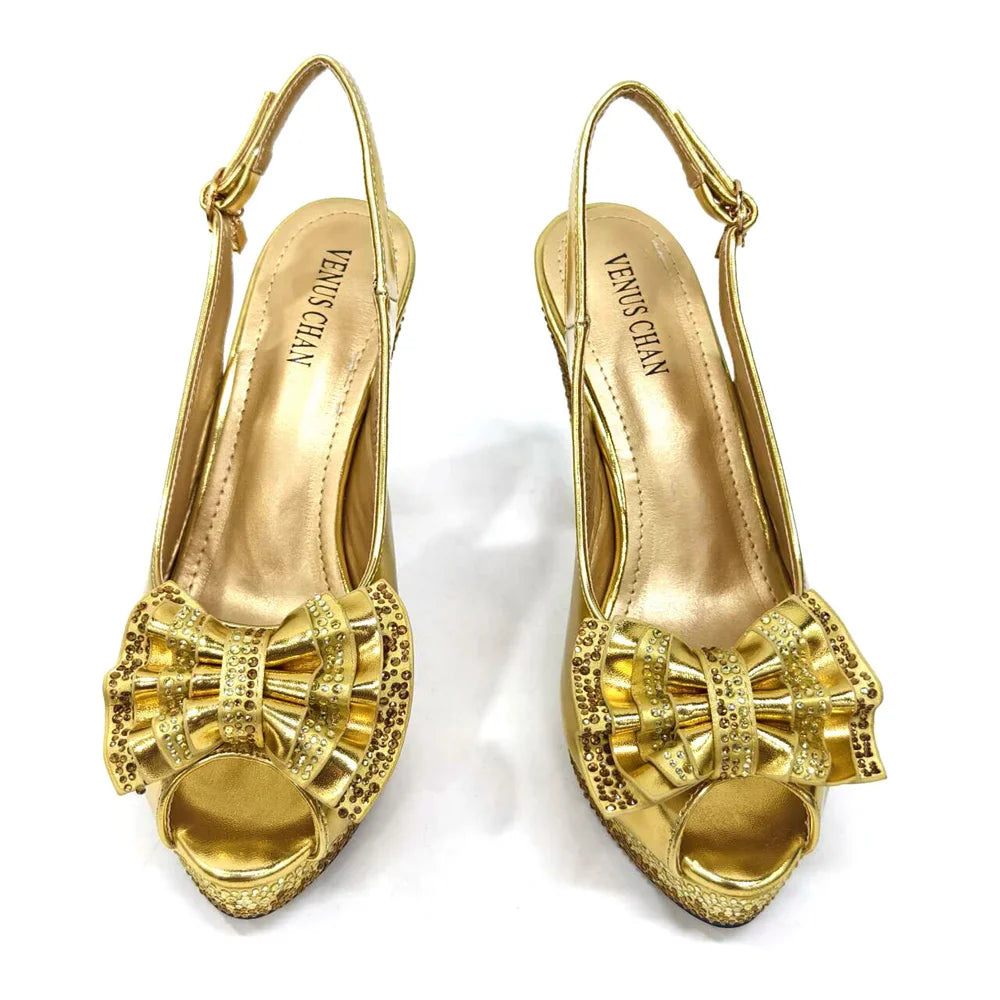 Fashionable green handbag with metal handle, complementing the Venus Chan open toe diamond pumps, ideal for upscale events and weddings.