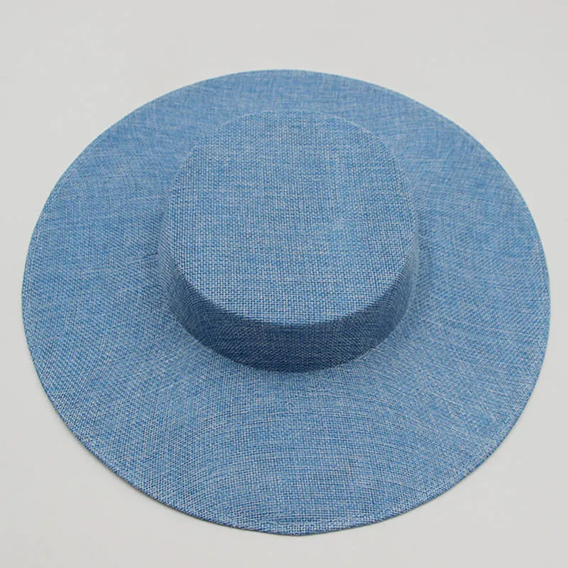 Sophisticated sinamay fascinator hat adorned with delicate embellishments, ideal for enhancing formal attire at weddings or garden parties.