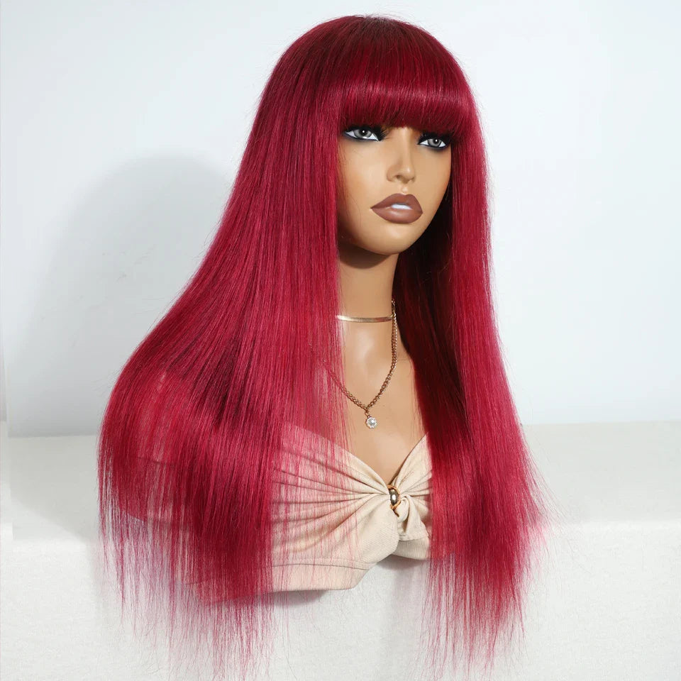 Close-up view of the rich red burgundy colour and silky texture of the Brazilian straight human hair wig with bangs, perfect for elegant transformations.