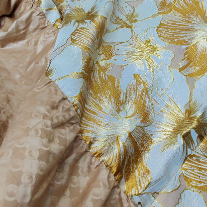 Stunning purple luxury boubou dress designed for African women, accentuated with rich bazin embroidery, ideal for weddings and festive occasions.