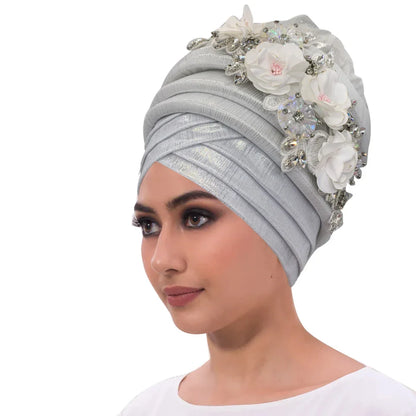 Luxurious African women's turban cap featuring a dazzling diamond flower embellishment for elegant head wrap styling.