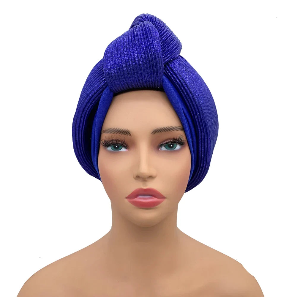 Sophisticated African gele headwrap in a luxurious turban style, designed for women aged Middle Age, with slight stretch for comfort.