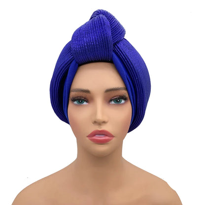 Sophisticated African gele headwrap in a luxurious turban style, designed for women aged Middle Age, with slight stretch for comfort.