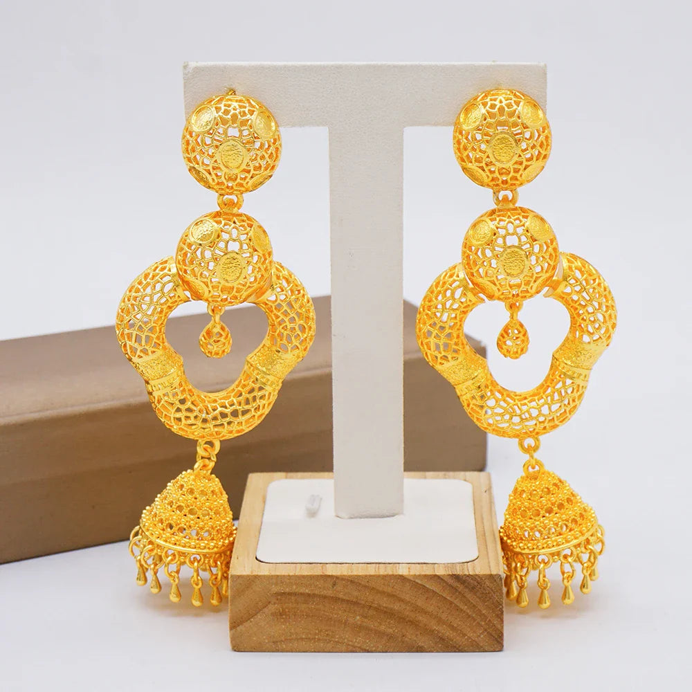 Exquisite drop earrings with a gold copper alloy finish, embodying a modern African aesthetic that complements any elegant outfit.