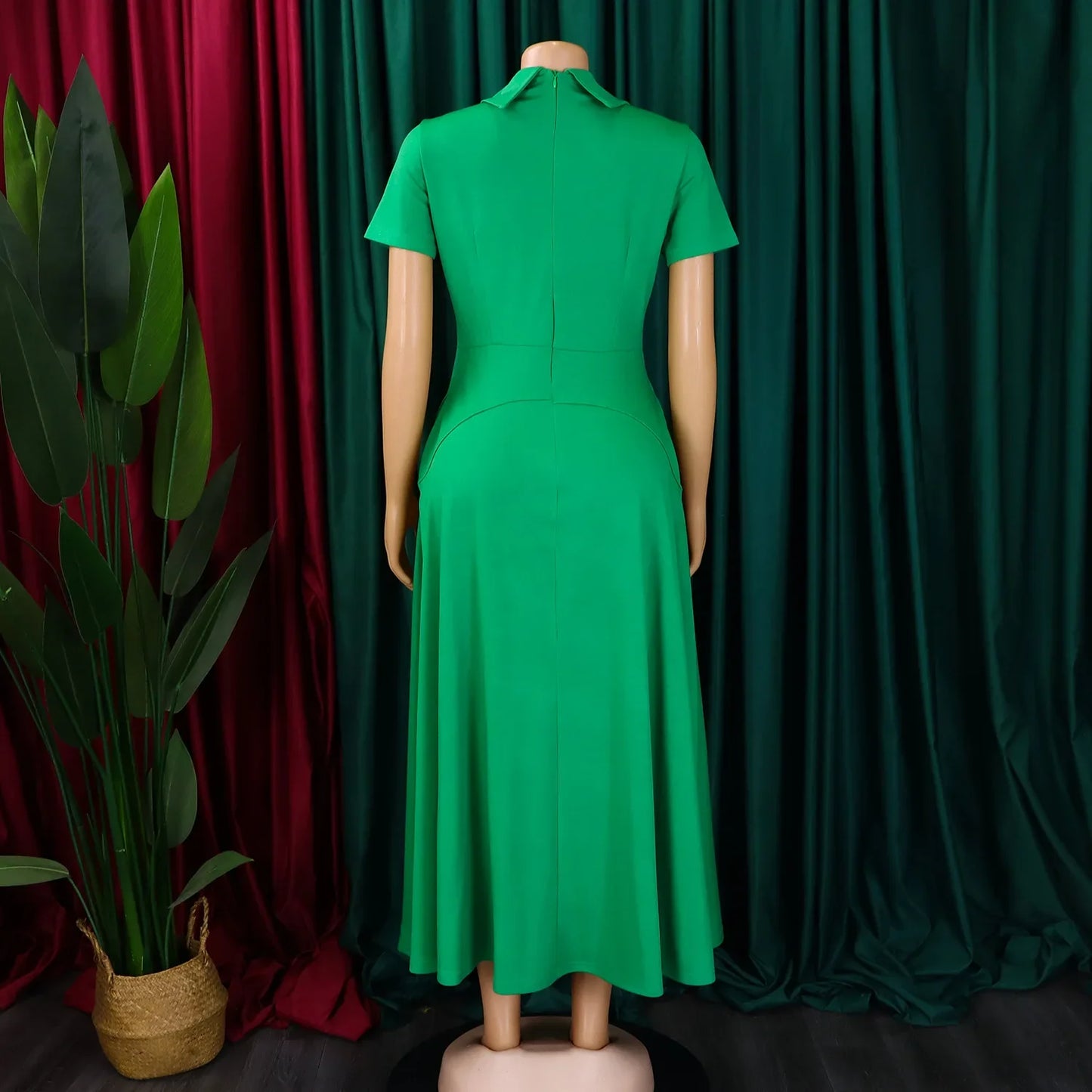 Back view of the elegant high-waisted evening dress, highlighting the fine craftsmanship and zipper closure for a tailored fit.